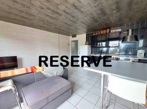 781 LAMOURA : T3 avec balcon en centre village